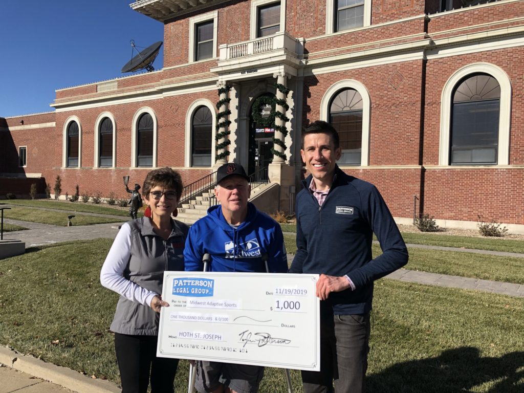 Midwest Adaptive Sports receiving 1,000 check