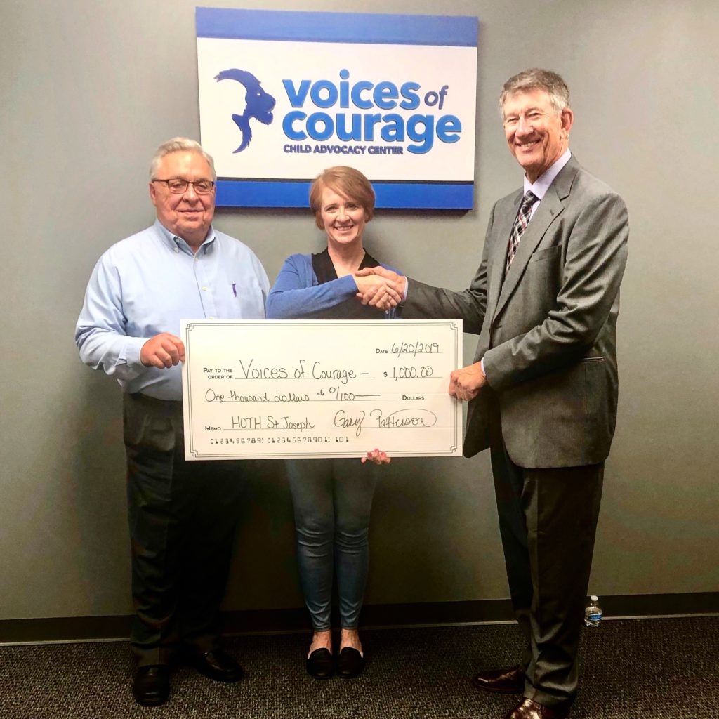 Voices of Courage receiving 1,000 check